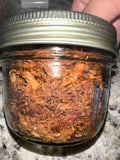 Adobo Flakes in a glass jar