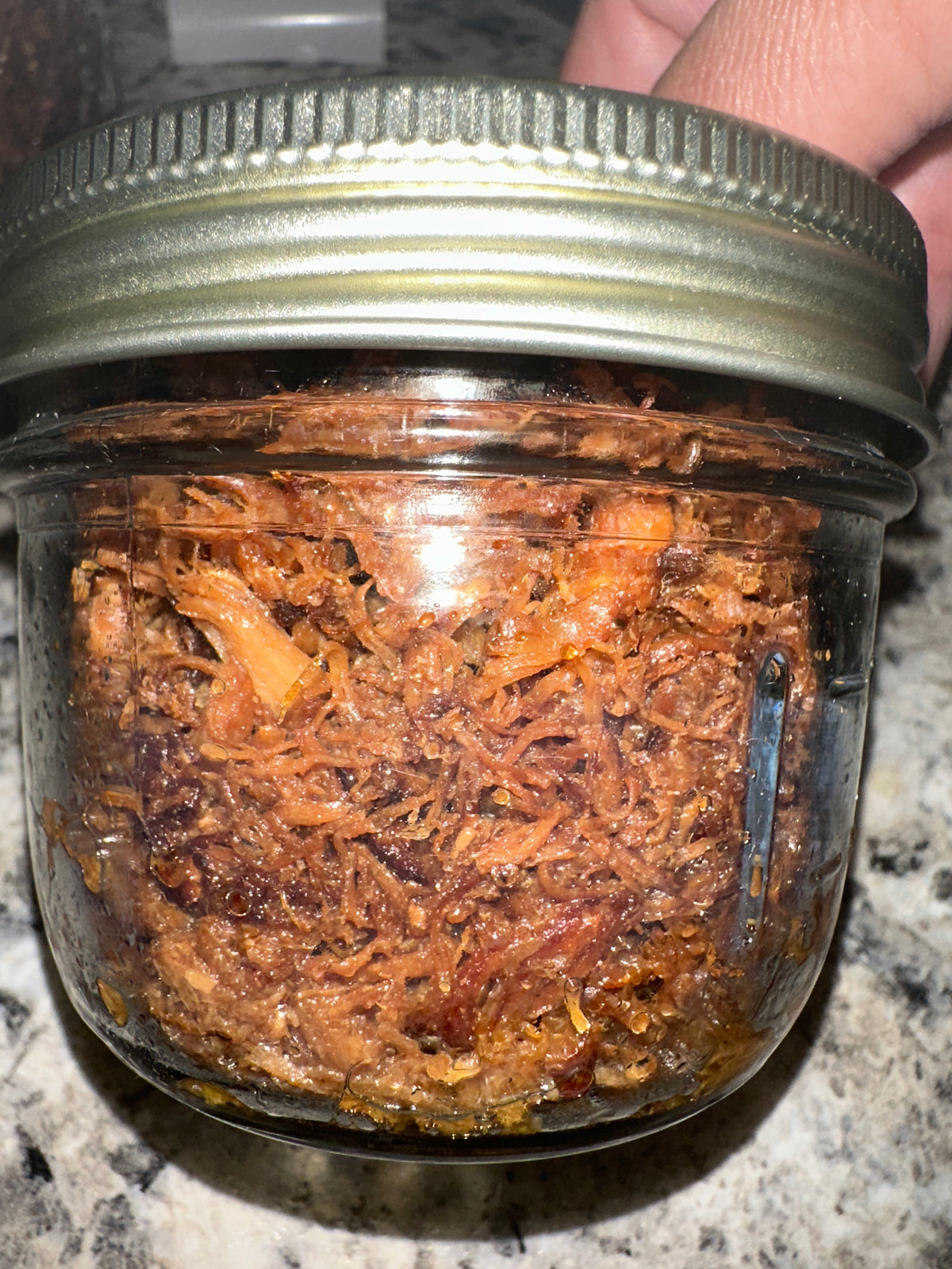Adobo Flakes in a glass jar